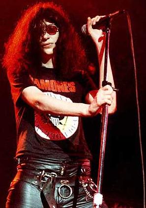 DON'T WORRY 'BOUT ME: Anchored as always by his tree-tall mic stand, Joey was the slouchy centerpiece of the Ramones' blitzkrieg bop.